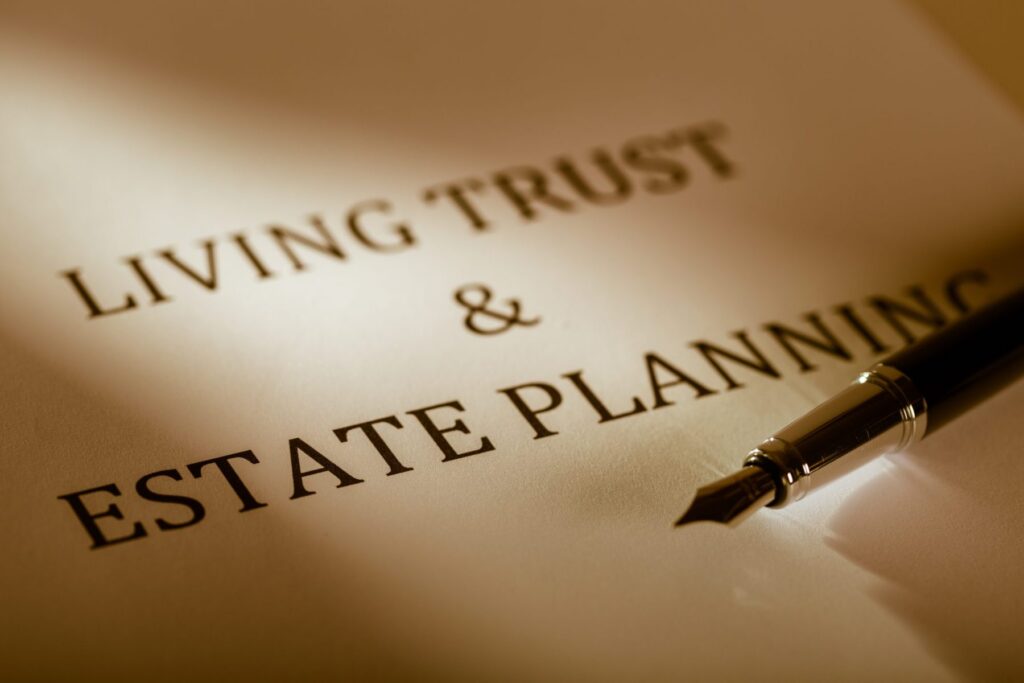 A document titled "Living Trust & Estate Planning," with a fountain pen resting on it, bathed in light. Perfectly poised for those navigating Hinsdale Wills or exploring Western Springs Estate Administration.
